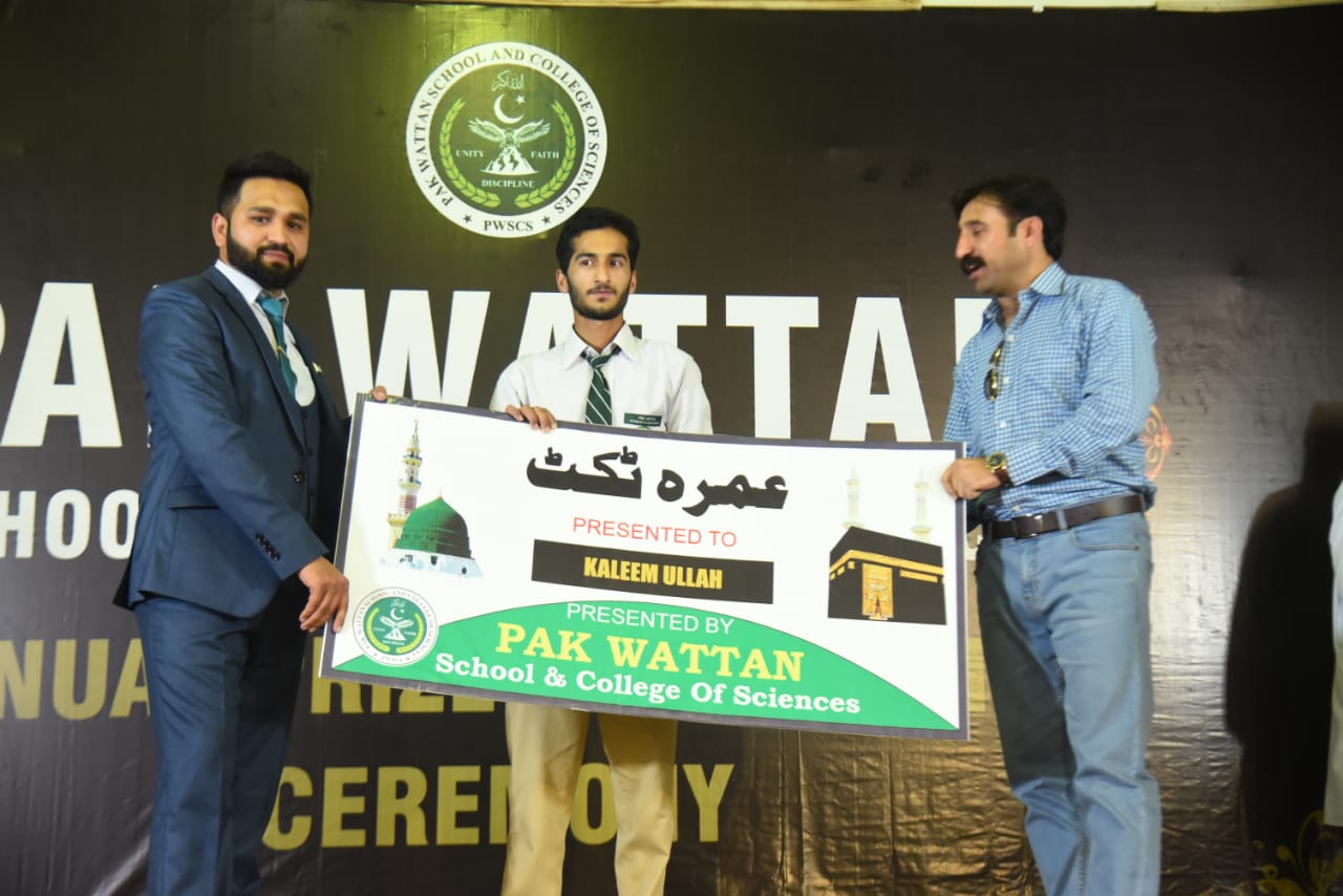 Kaleem Ullah receiving umrah ticket